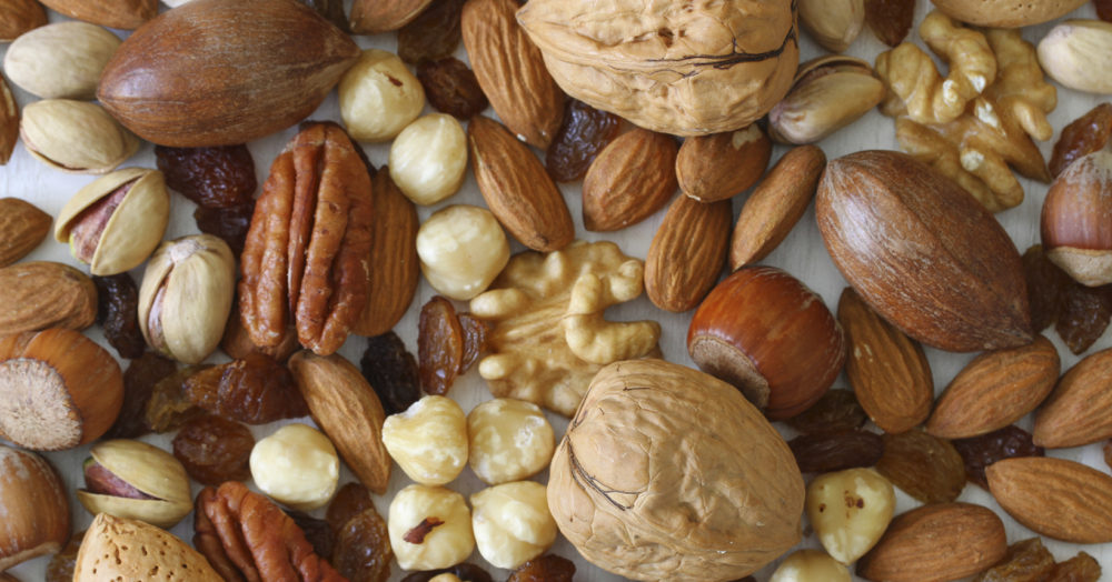 Selecion of nuts, almonds and sultanas, close up